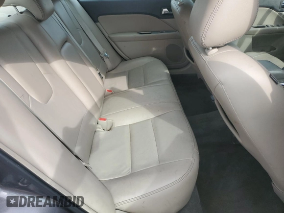 2012 Ford Fusion Hybrid z VIN 3FADP0L33CR211609, wystawiony jako Copart lot #60873005 z przebiegiem 144 474 mil mil oraz Szkoda całkowita • Salvage title. Historia ofert i sprzedaży dostępna na DreamBid. Obrazek 10.