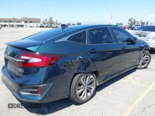 2018 Honda Clarity Touring with VIN JHMZC5F39JC022655, listed as a IAAI auction lot 42149002 with 118,913 mi miles. Bid and sale history available at carsss.com. Image 4.