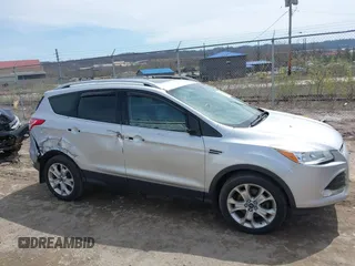 2016 Ford Escape Titanium with VIN 1FMCU9JX3GUA62802, listed as a IAAI auction lot 42001690 with 124,452 mi miles. Bid and sale history available at carsss.com. Image 13.