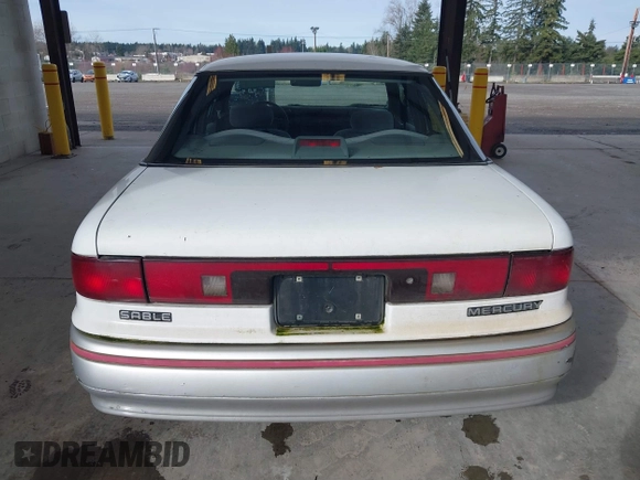 1992 Mercury Sable z VIN 1MECM5049NG647978, wystawiony jako IAAI lot #41805346 z przebiegiem 23 634 mil mil oraz . Historia ofert i sprzedaży dostępna na DreamBid. Obrazek 16.
