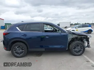2020 Mazda CX-5 Touring with VIN JM3KFACM2L0856777, listed as a IAAI auction lot 42073972 with 151,628 mi miles. Bid and sale history available at carsss.com. Image 14.