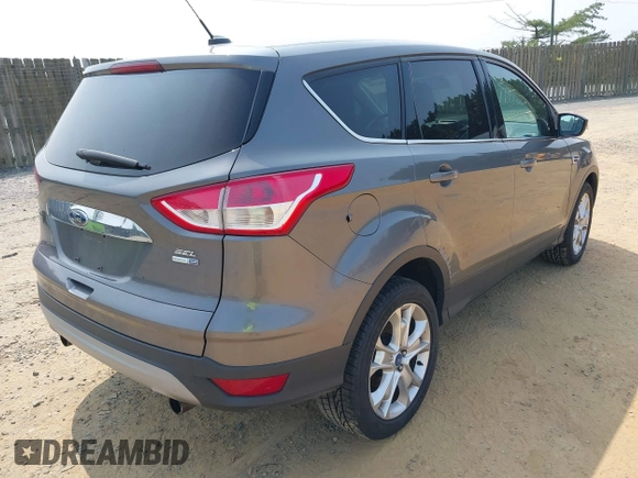 2013 Ford Escape SEL with VIN 1FMCU9H99DUC25469, listed as a IAAI auction lot 42402148 with 99,830 mi miles and . Bid and sale history available at DreamBid. Image 4.