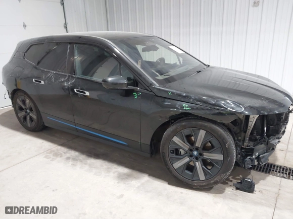 2023 BMW iX xDrive50 with VIN WB523CF04PCL15607, listed as a IAAI auction lot 41315457 with 44,058 mi miles. Bid and sale history available at carsss.com. Image 1.