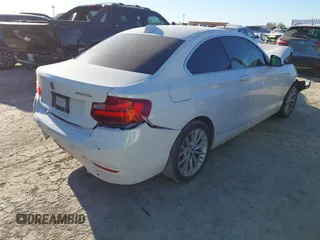 2015 BMW 2 Series 228i with VIN WBA1F5C53FV257086, listed as a IAAI auction lot 40898527 with 83,779 mi miles. Bid and sale history available at carsss.com. Image 4.