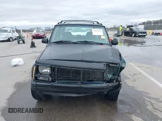 1996 Jeep Cherokee Sport with VIN 1J4FJ68S5TL235507, listed as a IAAI auction lot 41834736 with 174,634 mi miles. Bid and sale history available at carsss.com. Image 12.