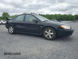 2001 Ford Taurus SEL with VIN 1FAFP56S01A258399, listed as a Copart auction lot 58963115 with 162,989 mi miles and Salvage title. Bid and sale history available at DreamBid. Image 4.