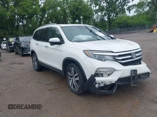 2018 Honda Pilot Touring with VIN 5FNYF6H91JB036788, listed as a IAAI auction lot 42312086 with 131,281 mi miles and . Bid and sale history available at DreamBid. Image 1.