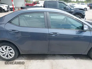 2018 Toyota Corolla L with VIN 5YFBURHE8JP770696, listed as a IAAI auction lot 42386025 with 63,224 mi miles and . Bid and sale history available at DreamBid. Image 13.