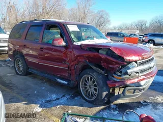 2002 Chevrolet Tahoe LT with VIN 1GNEK13Z82J299497, listed as a IAAI auction lot 41304388 with 146,007 mi miles. Bid and sale history available at carsss.com. Image 1.