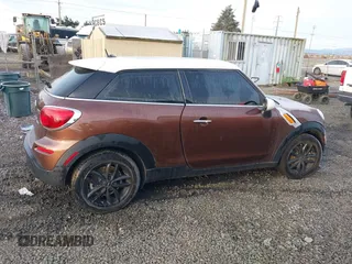 2014 MINI Paceman z VIN WMWSS1C58EWN94368, wystawiony jako IAAI lot #41377194 z przebiegiem 56 897 mil mil oraz . Historia ofert i sprzedaży dostępna na DreamBid. Obrazek 13.