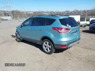 2013 Ford Escape SE with VIN 1FMCU9GX3DUB67956, listed as a IAAI auction lot 41901607 with 102,499 mi miles. Bid and sale history available at carsss.com. Image 3.