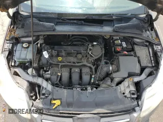 2012 Ford Focus SE z VIN 1FAHP3F22CL431070, wystawiony jako Copart lot #59569925 z przebiegiem 222 295 mil mil oraz Szkoda całkowita • Salvage title. Historia ofert i sprzedaży dostępna na DreamBid. Obrazek 11.