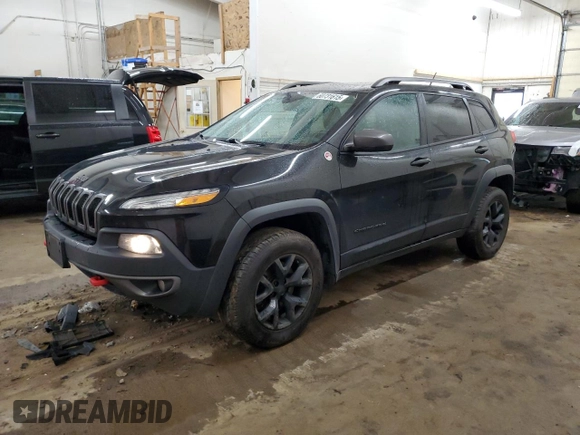 2015 Jeep Cherokee Trailhawk z VIN 1C4PJMBS0FW598694, wystawiony jako Copart lot #60731615 z przebiegiem 130 219 mil mil oraz Czysty tytuł • Clean title. Historia ofert i sprzedaży dostępna na DreamBid. Obrazek 1.
