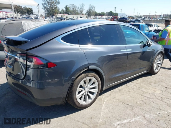 2018 Tesla Model X 75D with VIN 5YJXCBE26JF121937, listed as a IAAI auction lot 41652666 with 93,478 mi miles and . Bid and sale history available at carsss.com. Image 4.