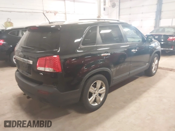 2012 Kia Sorento EX with VIN 5XYKUDA67CG306585, listed as a IAAI auction lot 42150969 with 128,792 mi miles. Bid and sale history available at carsss.com. Image 4.