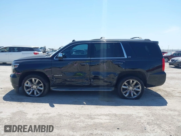 2015 Chevrolet Tahoe LTZ with VIN 1GNSCCKC4FR309152, listed as a IAAI auction lot 42029341 with 187,313 mi miles and . Bid and sale history available at DreamBid. Image 14.