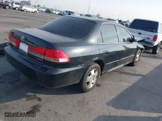 2002 Honda Accord Sdn EX w/Leather with VIN 1HGCG165X2A077913, listed as a IAAI auction lot 41470354 with 252,323 mi miles. Bid and sale history available at carsss.com. Image 4.