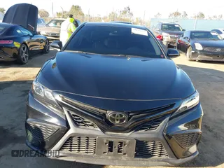 2021 Toyota Camry SE Nightshade with VIN 4T1G11AK2MU477363, listed as a IAAI auction lot 41675959 with 57,507 mi miles. Bid and sale history available at carsss.com. Image 13.