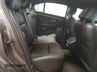 2014 Ford Taurus SEL z VIN 1FAHP2E85EG146469, wystawiony jako Copart lot #59506195 z przebiegiem 158 124 mil mil oraz Szkoda całkowita • Salvage title. Historia ofert i sprzedaży dostępna na DreamBid. Obrazek 10.