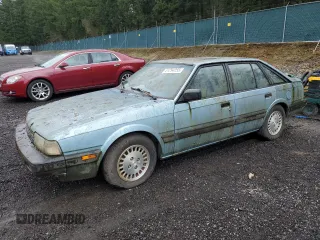 1986 Mazda 626 z VIN JM1GC2419G1805679, wystawiony jako Copart lot #51294255 z przebiegiem 131 757 mil mil oraz Czysty tytuł • Clean title. Historia ofert i sprzedaży dostępna na DreamBid. Obrazek 1.