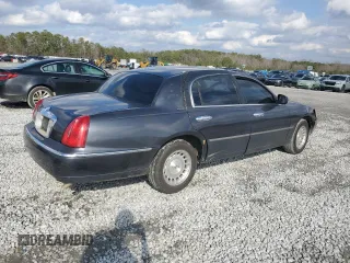 1999 Lincoln Town Car Executive z VIN 1LNHM81W4XY714116, wystawiony jako Copart lot #44424595 z przebiegiem 210 041 mil mil oraz Szkoda całkowita • Salvage title. Historia ofert i sprzedaży dostępna na DreamBid. Obrazek 3.
