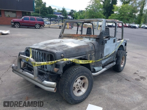 2000 Jeep Wrangler Sport with VIN 1J4FA49S5YP797345, listed as a IAAI auction lot 40322775 with Not Provided miles and . Bid and sale history available at DreamBid. Image 12.