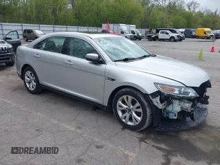 2012 Ford Taurus SEL z VIN 1FAHP2EW1CG134363, wystawiony jako IAAI lot #42180692 z przebiegiem 163 193 mil mil oraz . Historia ofert i sprzedaży dostępna na DreamBid. Obrazek 1.