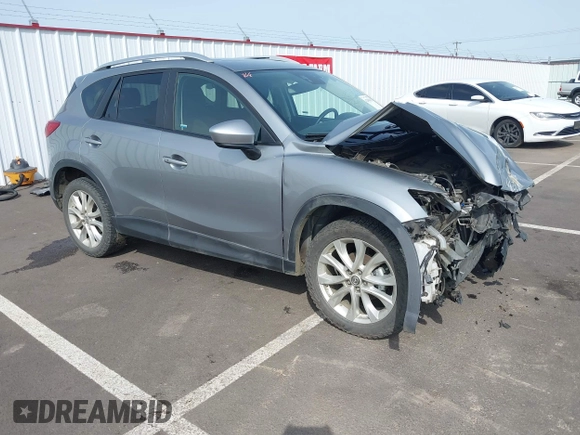 2014 Mazda CX-5 Grand Touring with VIN JM3KE4DY9E0375014, listed as a IAAI auction lot 42000382 with 110,584 mi miles and . Bid and sale history available at DreamBid. Image 1.