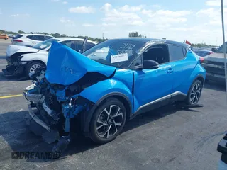 2019 Toyota C-HR XLE with VIN NMTKHMBX6KR097934, listed as a IAAI auction lot 39276687 with 56,973 mi miles. Bid and sale history available at carsss.com. Image 2.
