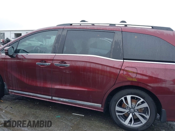 2021 Honda Odyssey Touring with VIN 5FNRL6H88MB006938, listed as a IAAI auction lot 42367022 with 63,280 mi miles and . Bid and sale history available at DreamBid. Image 13.