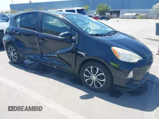 2012 Toyota Prius c One with VIN JTDKDTB36C1527223, listed as a IAAI auction lot 42002927 with 138,176 mi miles. Bid and sale history available at carsss.com. Image 1.