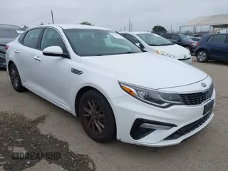 2019 Kia Optima LX with VIN 5XXGT4L35KG324274, listed as a IAAI auction lot 42111177 with 126,494 mi miles. Bid and sale history available at carsss.com. Image 1.
