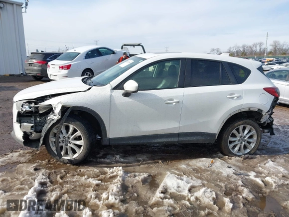 2014 Mazda CX-5 Grand Touring with VIN JM3KE4DY9E0300491, listed as a IAAI auction lot 41657153 with 157,394 mi miles and . Bid and sale history available at DreamBid. Image 14.