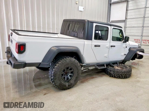 2023 Jeep Gladiator Sport S with VIN 1C6HJTAG1PL542530, listed as a Copart auction lot 60669075 with 44,323 mi miles and Salvage title. Bid and sale history available at DreamBid. Image 4.