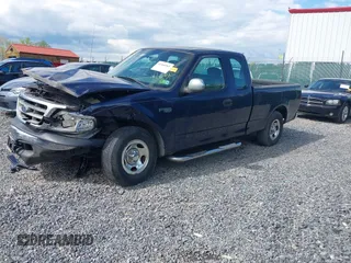 2003 Ford F-150 XL with VIN 1FTRX17223NB22897, listed as a IAAI auction lot 42166965 with 207,627 mi miles and . Bid and sale history available at DreamBid. Image 2.