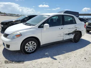 2010 Nissan Versa S with VIN 3N1BC1AP0AL386850, listed as a Copart auction lot 60657155 with 127,227 mi miles and Salvage title. Bid and sale history available at DreamBid. Image 1.