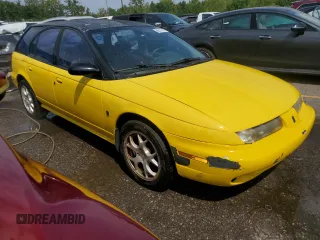 1999 Saturn SW z VIN 1G8ZK8279XZ197938, wystawiony jako Copart lot #68818514 z przebiegiem Nie podano mil oraz Tytuł czysty. Historia ofert i sprzedaży dostępna na DreamBid. Obrazek 4.