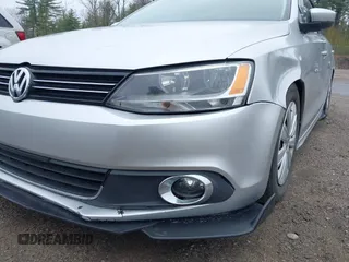 2014 Volkswagen Jetta S z VIN 3VW1K7AJ6EM413671, wystawiony jako IAAI lot #42145258 z przebiegiem 109 211 mil mil oraz . Historia ofert i sprzedaży dostępna na DreamBid. Obrazek 6.