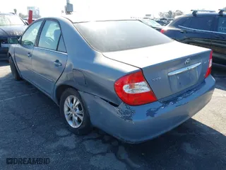 2004 Toyota Camry LE with VIN 4T1BF32K94U576056, listed as a IAAI auction lot 41721057 with 259,906 mi miles. Bid and sale history available at carsss.com. Image 3.