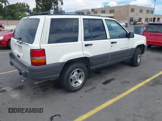 1996 Jeep Grand Cherokee Laredo with VIN 1J4FX58S5TC388512, listed as a IAAI auction lot 42803796 with 147,732 mi miles and . Bid and sale history available at DreamBid. Image 4.