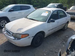 1997 Ford Escort LX with VIN 1FALP13P4VW278594, listed as a IAAI auction lot 42125007 with 290,855 mi miles. Bid and sale history available at carsss.com. Image 2.