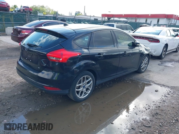 2015 Ford Focus SE with VIN 1FADP3K2XFL319559, listed as a IAAI auction lot 42205107 with 184,499 mi miles. Bid and sale history available at carsss.com. Image 4.