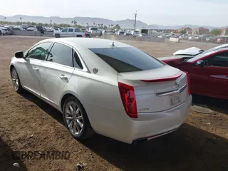 2014 Cadillac XTS Luxury with VIN 2G61M5S35E9199253, listed as a IAAI auction lot 41400558 with 112,955 mi miles. Bid and sale history available at carsss.com. Image 3.