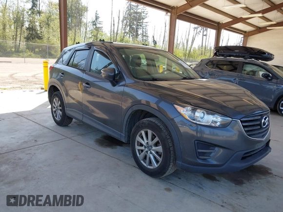 2016 Mazda CX-5 Sport with VIN JM3KE4BY1G0910102, listed as a IAAI auction lot 42115163 with 144,495 mi miles and . Bid and sale history available at carsss.com. Image 1.