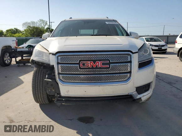 2014 GMC Acadia Denali z VIN 1GKKVTKD2EJ358735, wystawiony jako Copart lot #52299545 z przebiegiem 192 817 mil mil oraz Czysty tytuł • Clean title. Historia ofert i sprzedaży dostępna na DreamBid. Obrazek 5.