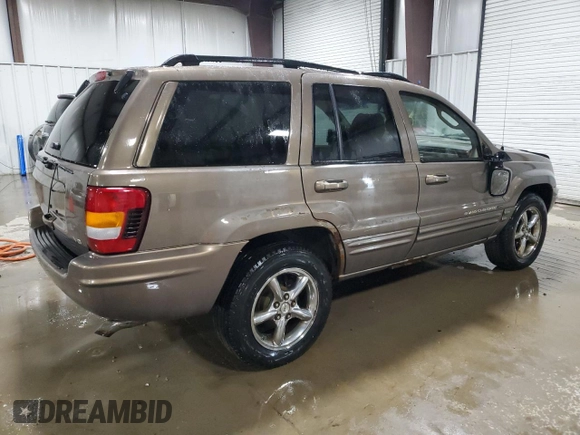 2002 Jeep Grand Cherokee Limited with VIN 1J4GW58NX2C248892, listed as a Copart auction lot 55574615 with 164,010 mi miles and Salvage title. Bid and sale history available at DreamBid. Image 3.
