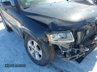 2016 Jeep Grand Cherokee Laredo z VIN 1C4RJFAG0GC425732, wystawiony jako IAAI lot #41641806 z przebiegiem 174 871 mil mil oraz . Historia ofert i sprzedaży dostępna na DreamBid. Obrazek 19.