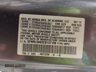 2012 Honda Odyssey EX-L with VIN 5FNRL5H63CB137198, listed as a IAAI auction lot 42706690 with 305,753 mi miles and . Bid and sale history available at DreamBid. Image 9.