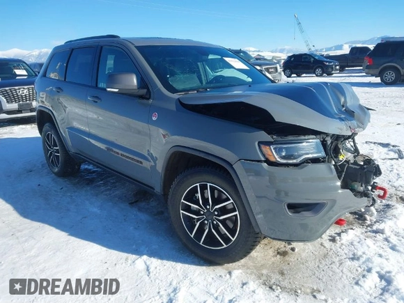 2021 Jeep Grand Cherokee Trailhawk with VIN 1C4RJFLG2MC854007, listed as a IAAI auction lot 41512394 with 50,674 mi miles. Bid and sale history available at carsss.com. Image 1.