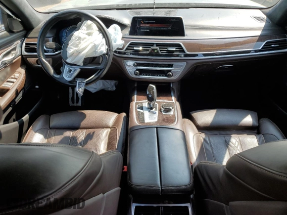 2017 BMW 7 Series 750i xDrive with VIN WBA7B0C57HG527064, listed as a Copart auction lot 62463405 with 103,454 mi miles and Salvage title. Bid and sale history available at DreamBid. Image 8.